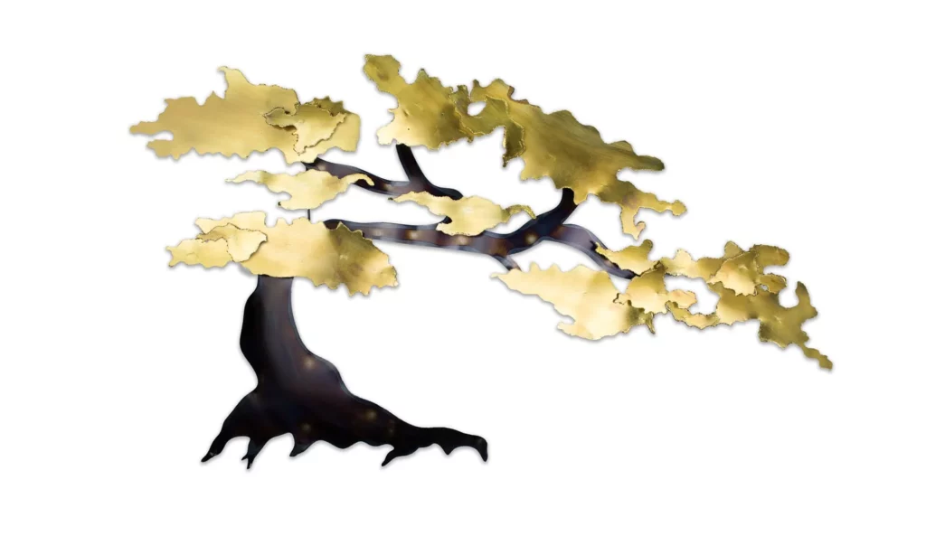 A tree metal wall decoration in gold and black