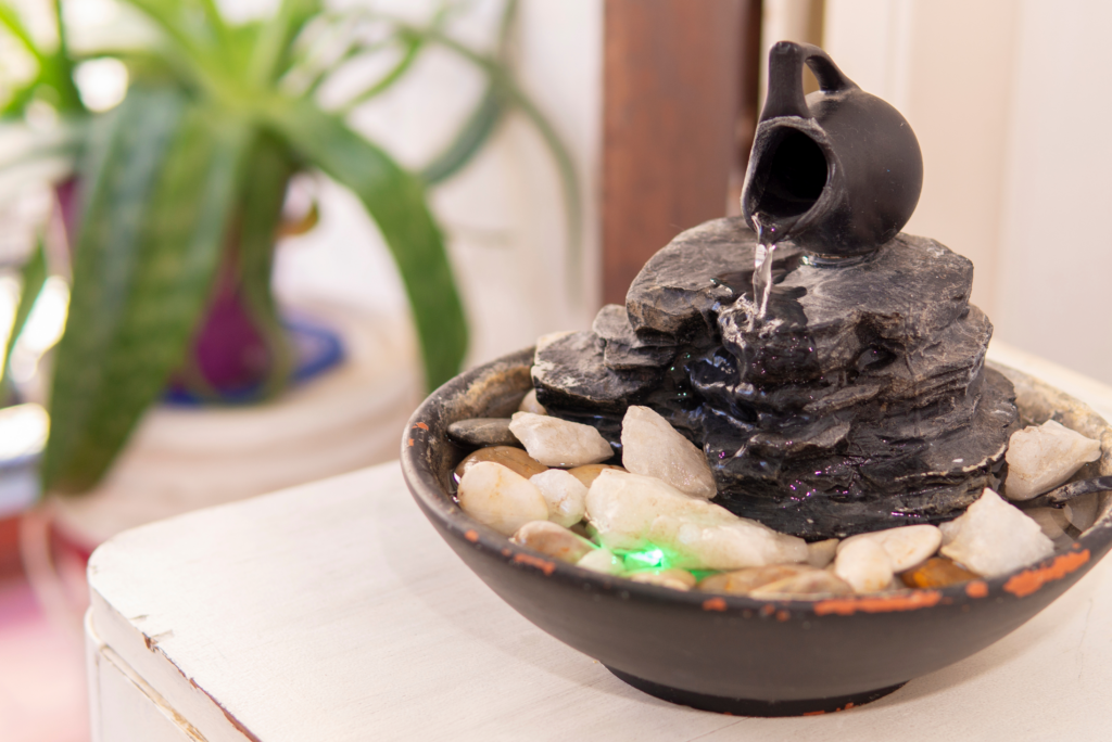 A DIY table fountain with stone and jar accent