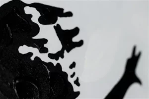 A close up look of a hand painted girl with a balloon