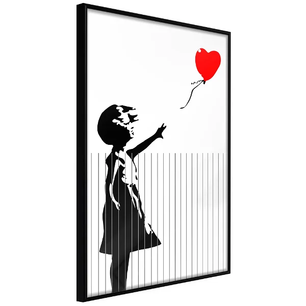 A shredded poster of a girl with a red balloon