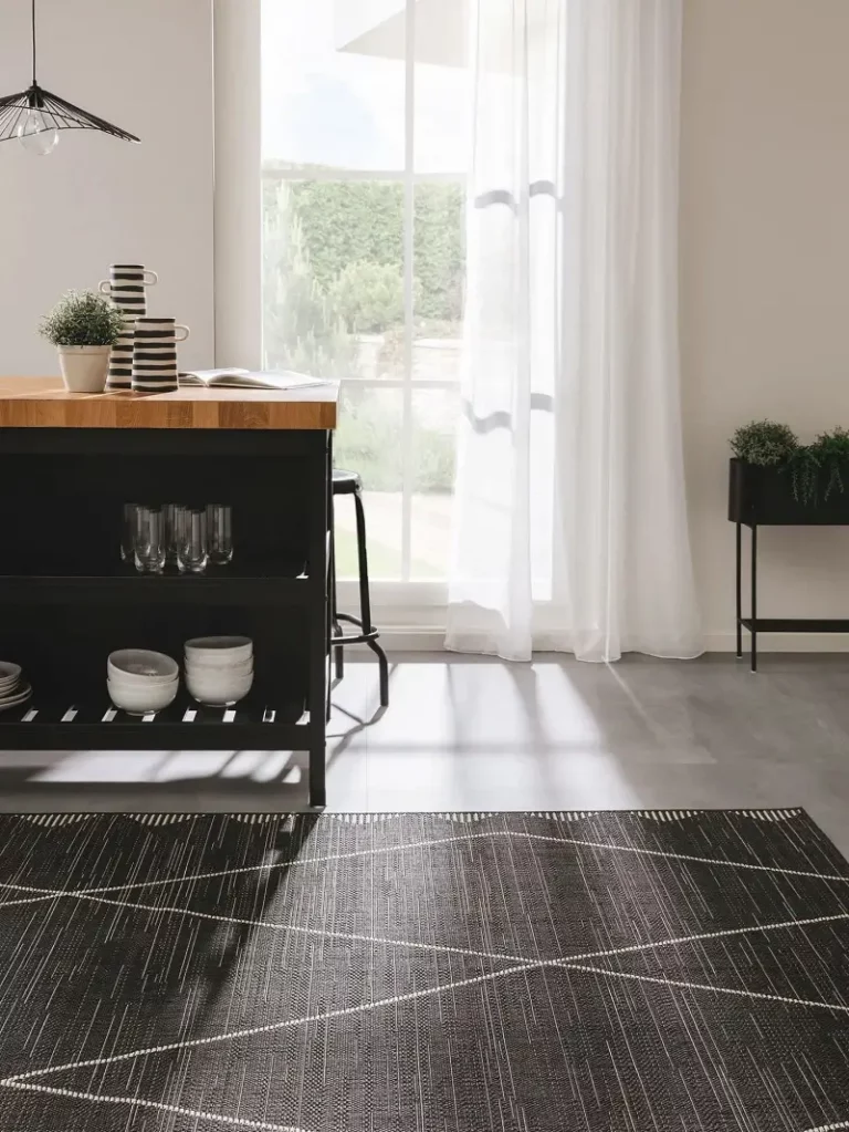 an indoor carpet with a color of black and gray line accent