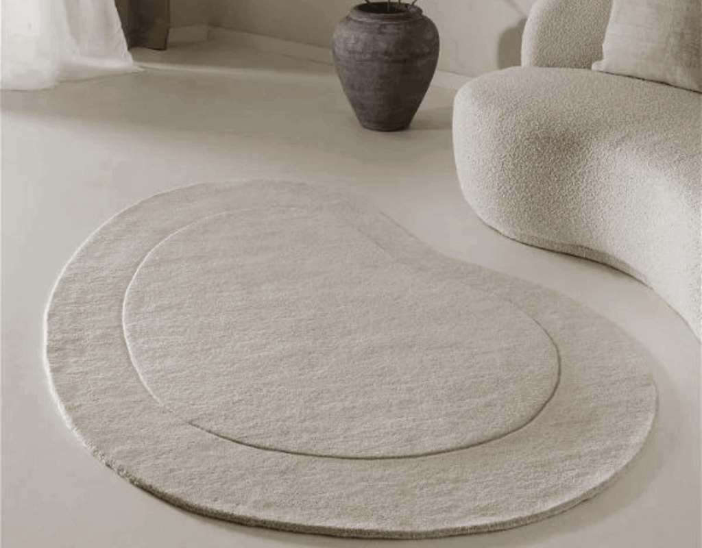an off-white color rug in the living room in minimalist living room accessories