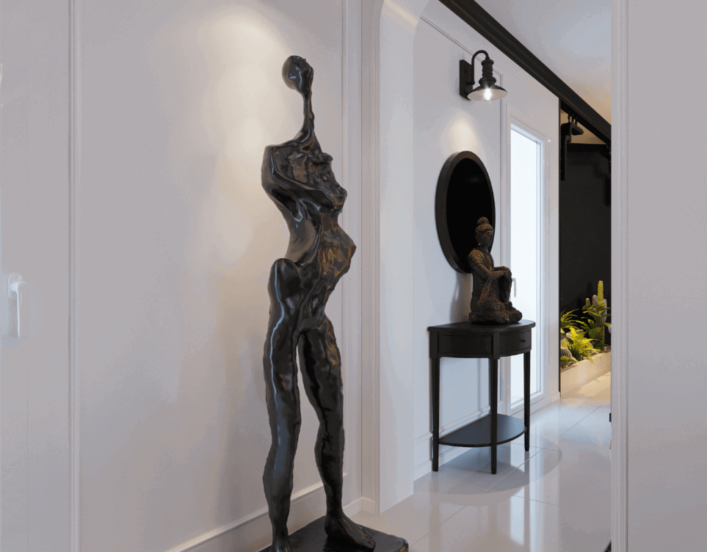 An image of a human size black sculpture in the hallway