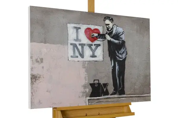 A landscape canvas with a guy as an image and text of I love new york.