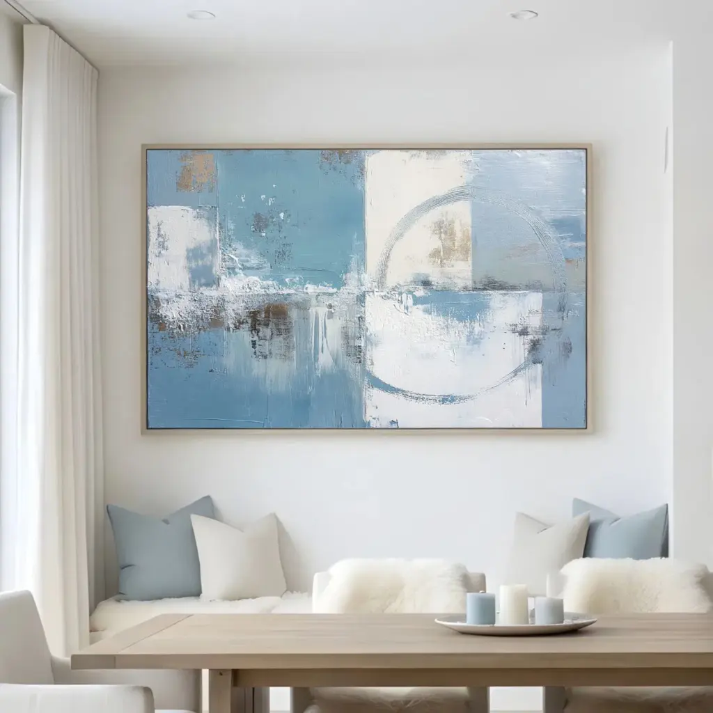 Abstract blue and white painting above living room table